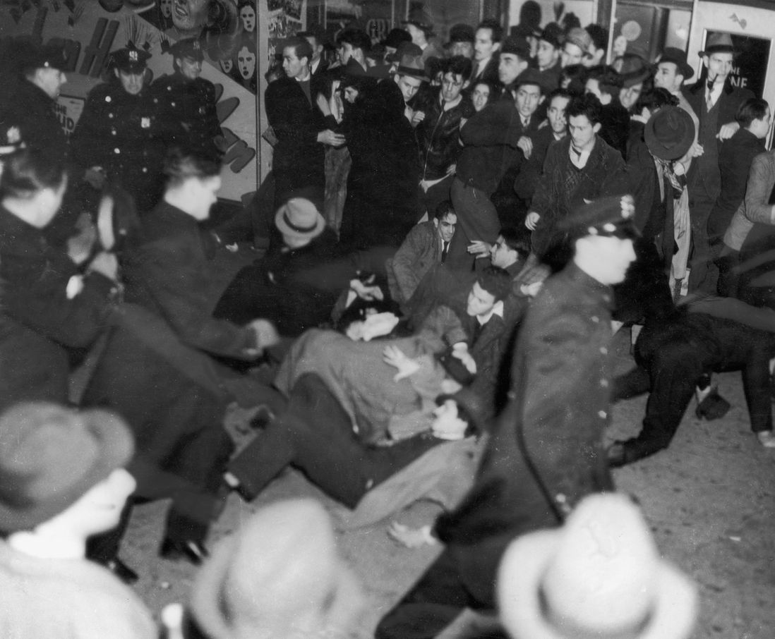 Police officers struggle with crowds gathered to protest against the German-American Federation meeting, chaired by German-American Bund leader Fritz Kuhn, at Madison Square Garden, 2 March 1939. The German-American Federation was an American Nazi organization established in the 1930s. (Getty)